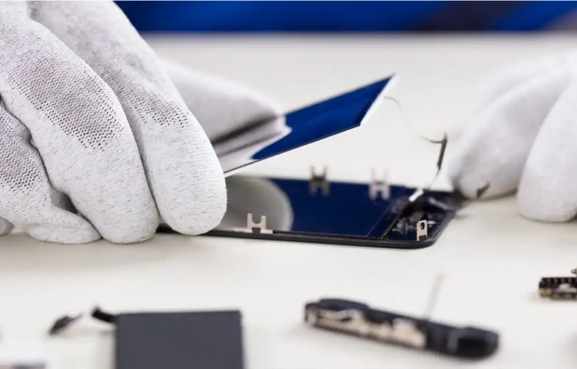 A person replacing a phone screen